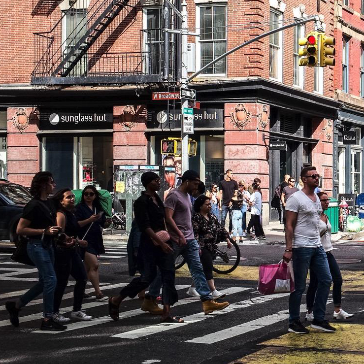 People walking across crosswalk